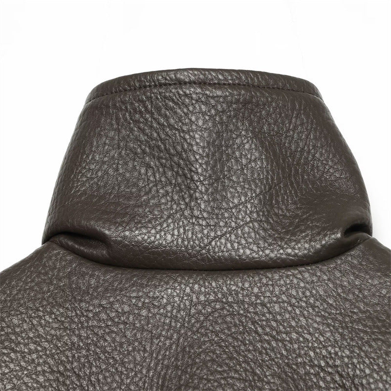 Brown faux leather jacket collar and textured surface detail