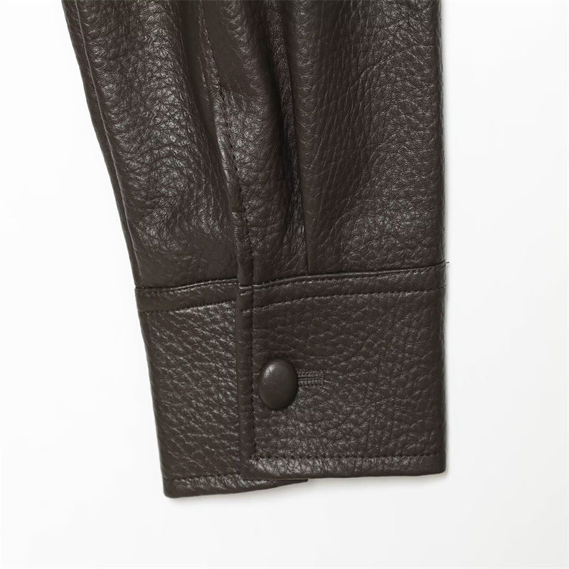Brown faux leather jacket snap-tab cuff close-up