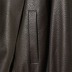 Brown faux leather jacket side welt pocket close-up