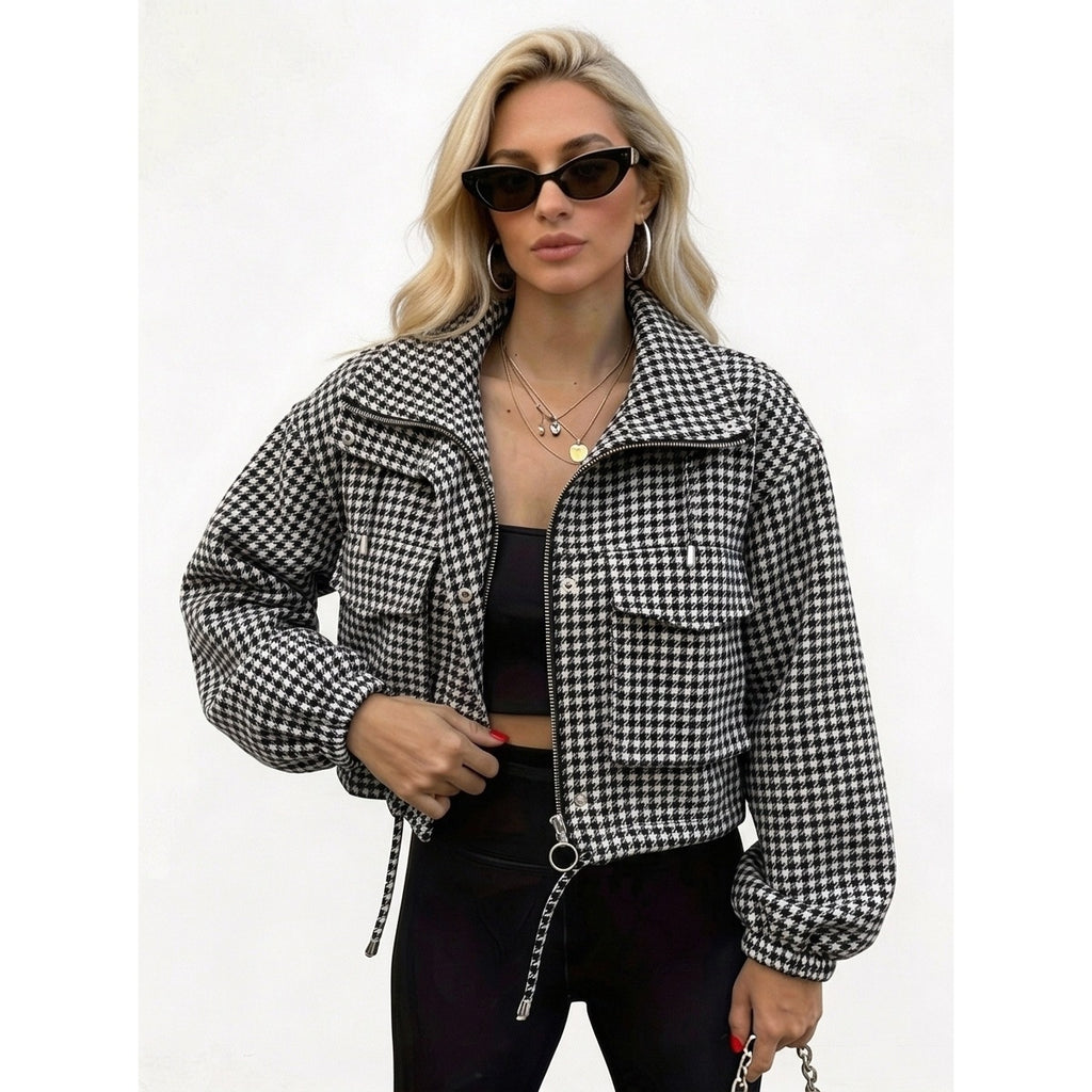 Woman wearing a black and white houndstooth cropped utility jacket