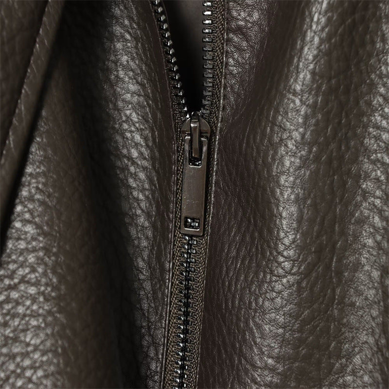 Brown faux leather jacket asymmetric zipper close-up