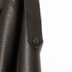Brown faux leather jacket shoulder epaulette and snap detail